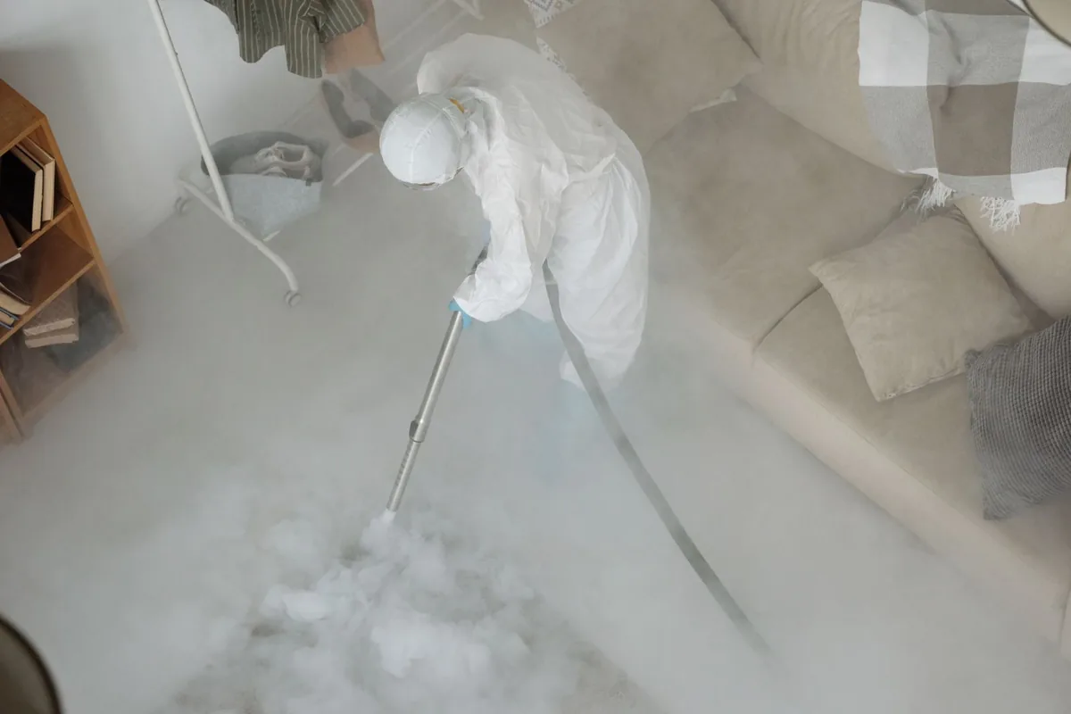 Biohazard cleanup technician in protective equipment, Rice Lake, MN